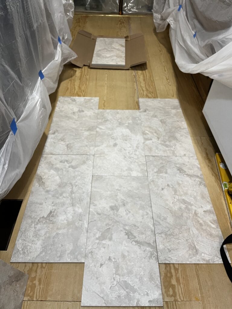 Armstrong Alterna engineered vinyl tiles laid out on a kitchen floor during a renovation