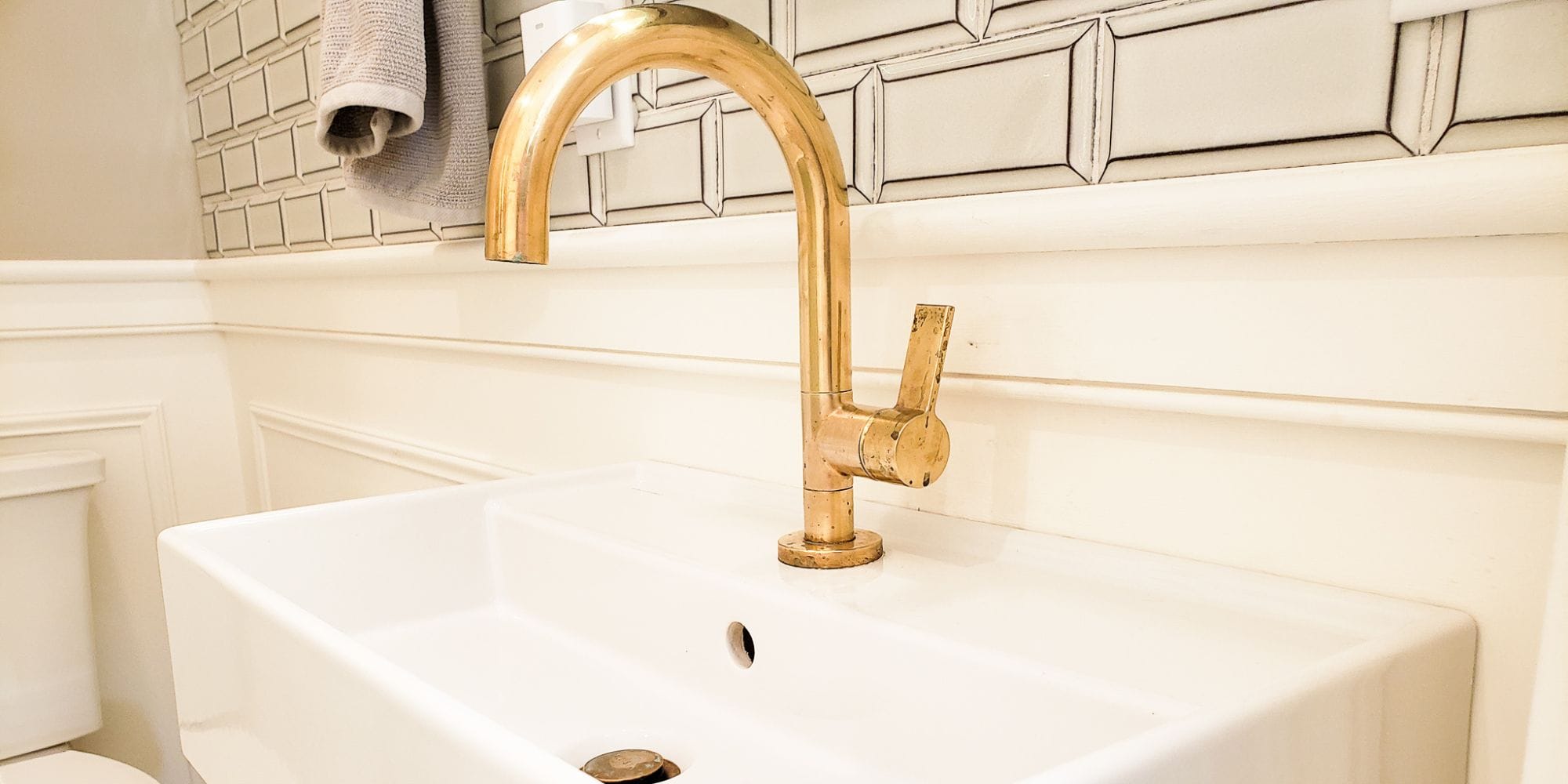 Unlaquered brass Kallista faucet in a bathroom remodel in Portsmouth, NH