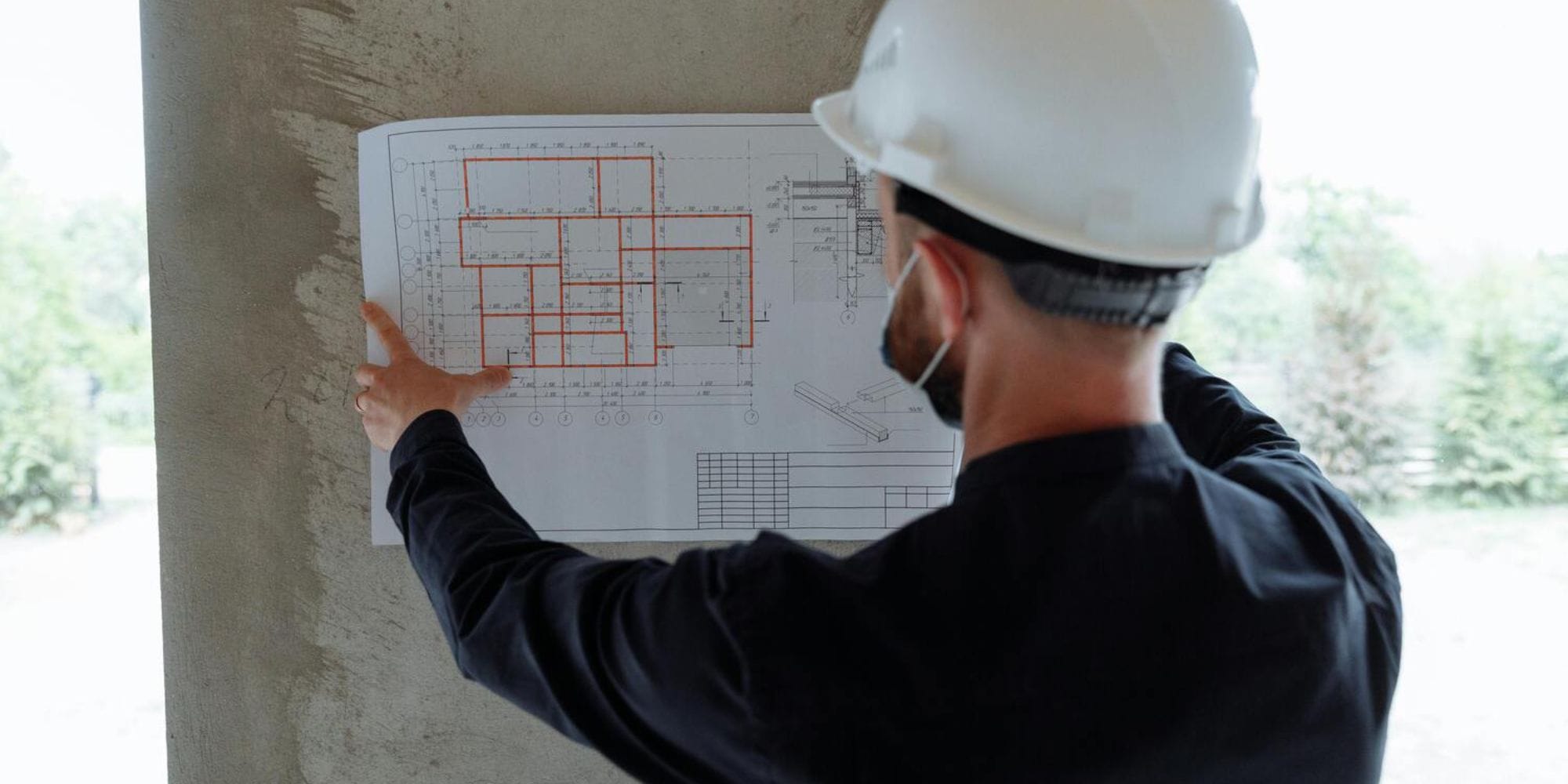 Remodel contractor in Rye, NH studying the plans for a home remodel