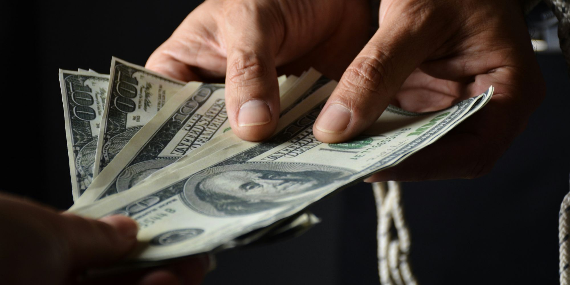 People transferring cash to pay a deposit to a contractor in Portsmouth, NH