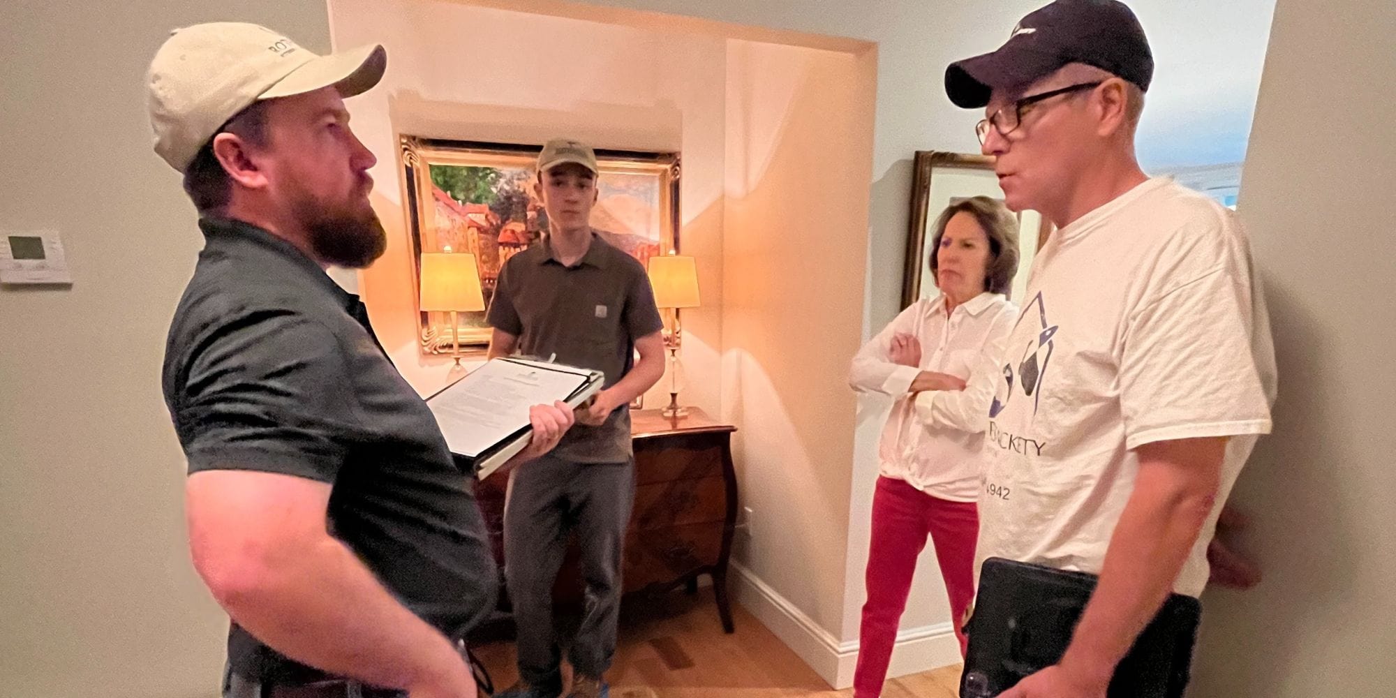 Contractors discussing a home renovation in Exeter, NH with a homeowner