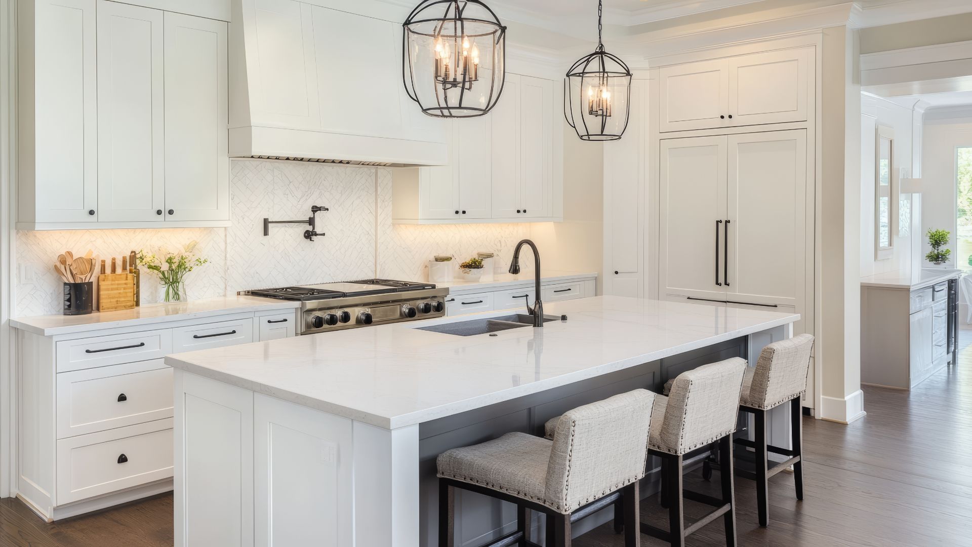 Custom kitchen remodel in Exeter, NH with quartz countertops, tile backsplash, and undercabinet lighting