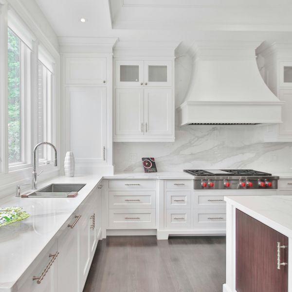 Kitchen remodel in North Hampton, NH with custom cabinetry, quartz countertops, large island, and gas cooktop