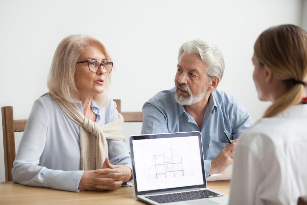 A homeowner couple meets with a designer to plan a multiple-room remodel in North Hampton, NH.