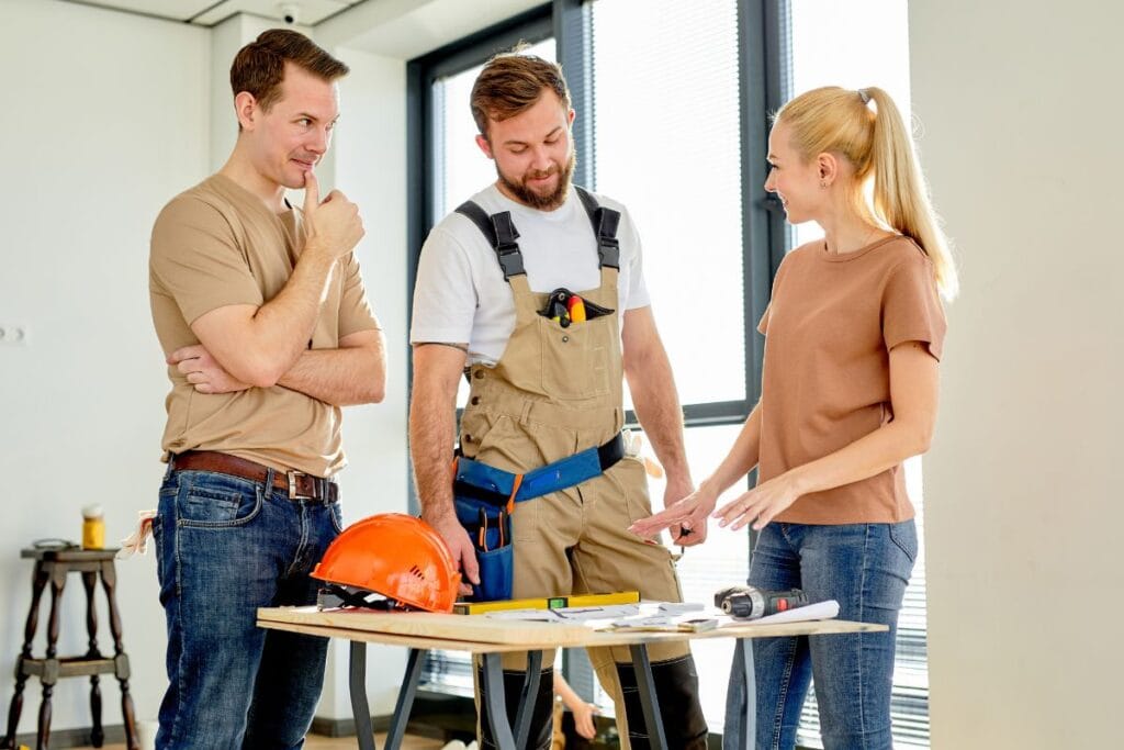 Woman talking with contractors during a renovation